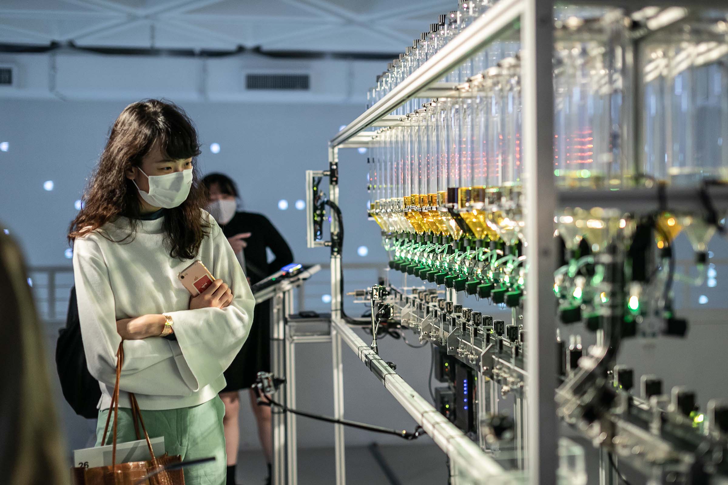 Person working with perfume machine
